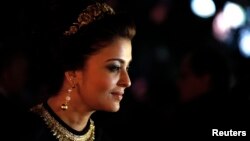 Indian actress Aishwarya Rai poses as she arrives at the evening's gala of the film "Bombay Talkies" celebrating a hundred years of Indian cinema, during the 66th Cannes Film Festival in Cannes May 19, 2013.