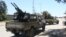 Gun-mounted vehicles belonging to fighters loyal to the internationally recognized Libyan Government of National Accord (GNA) are pictured near a military compound in a suburb of the capital Tripoli on April 9, 2019.