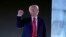 FILE - Republican presidential nominee former President Donald Trump gestures as he concludes speaking at a campaign event at the Butler Farm Show, in Butler, Pennsylvania, Oct. 5, 2024.