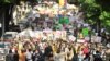 Pengunjuk rasa berpawai dalam demo menentang ketidakadilan ras dan kematian Rayshard Brooks di Atlanta, Georgia, AS, 15 Juni 2020. (Foto: Alex Hicks Jr.-USA TODAY NETWORK)