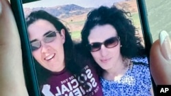 FILE - In this September 2018 image provided by Emma Tsurkov, right, she and sister Elizabeth Tsurkov are shown in California. Elizabeth Tsurkov has been held by an Iraqi militia since her kidnapping nearly two years ago.