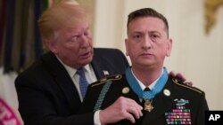 President Donald Trump awards the Medal of Honor to Army Staff Sgt. David Bellavia in the East Room of the White House in Washington, June 25, 2019, for conspicuous gallantry while serving in support of Operation Phantom Fury.