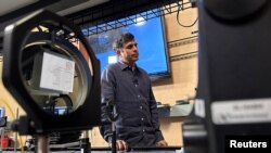 FILE — Mahesh Krishnaswamy, leader of Taara, a project in Alphabet's so-called moonshot factory, looks on as he stands in a lab, in Mountain View, California, U.S. June 21, 2023. 