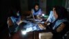 Afghan election workers count ballots in the presidential elections at a polling station in Kabul, Afghanistan, Sept. 28, 2019. An unofficial estimate put voter turnout at a little more than 2 million voters out of nearly 10 million.