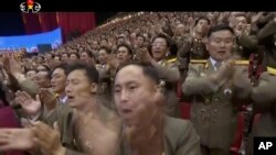 Image made from undated video of a news bulletin aired by North Korea's KRT on July 10, 2017, shows soldiers applauding N, Korea's leader Kim Jong Un in Pyongyang for the successful launch of his country's first intercontinental ballistic missile.