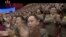 Image made from undated video of a news bulletin aired by North Korea's KRT on July 10, 2017, shows soldiers applauding N, Korea's leader Kim Jong Un in Pyongyang for the successful launch of his country's first intercontinental ballistic missile.