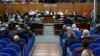 People sit in the courthouse during the trial of four senior members of Egyptian security services over their suspected role in the disappearance and murder of Italian student Giulio Regeni in Cairo in 2016. The trial is in Rome, Italy, on February 20, 2024.