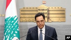 FILE - Lebanese Prime Minister Hassan Diab, gives a speech at the Government House in Beirut, Lebanon.