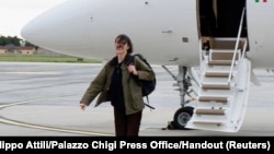 Italian journalist Cecilia Sala walks at Rome's Ciampino military airport in Rome, after she was freed from detention in Iran, Jan. 8, 2025. 