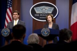 French Minister of Armed Forces Florence Parly and Secretary of Defense Mark Esper speak during a news conference at the Pentagon in Washington, Jan. 27, 2020.