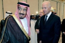 FILE - In this Oct. 27, 2011, photo, then-U.S. Vice President Joe Biden offers his condolences to then-Prince Salman bin Abdel-Aziz upon the death of his brother, Saudi Crown Prince Sultan bin Abdul-Aziz Al Saud, in Riyadh.