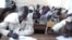 South Sudanese children sit an exam in a high school in Aweil in Northern Bahr el Ghazal state on March 20, 2013. (VOA/Hou Akot Hou)