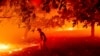 Matt Nichols tries to save his home as the LNU Lightning Complex fires tear through Vacaville, California.