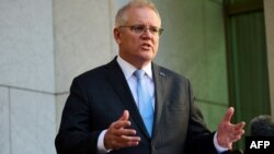 FILE - Australian Prime Minister Scott Morrison speaks during a press conference at Parliament House in Canberra, Aug. 17, 2021. 