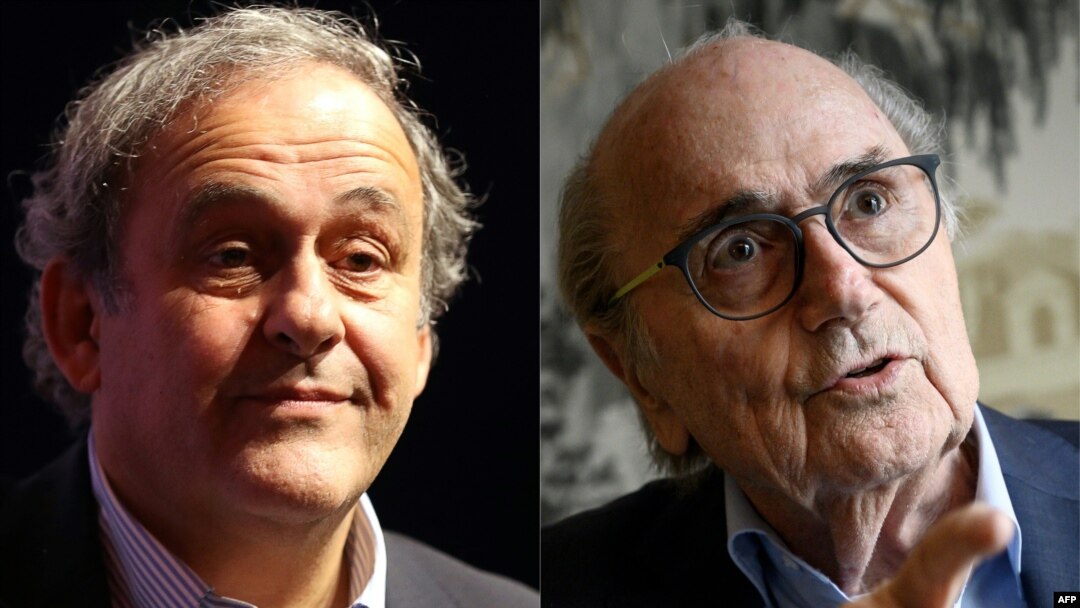 Mišel Platini i Sep Blater (Foto: VALERY HACHE, Fabrice COFFRINI / AFP)