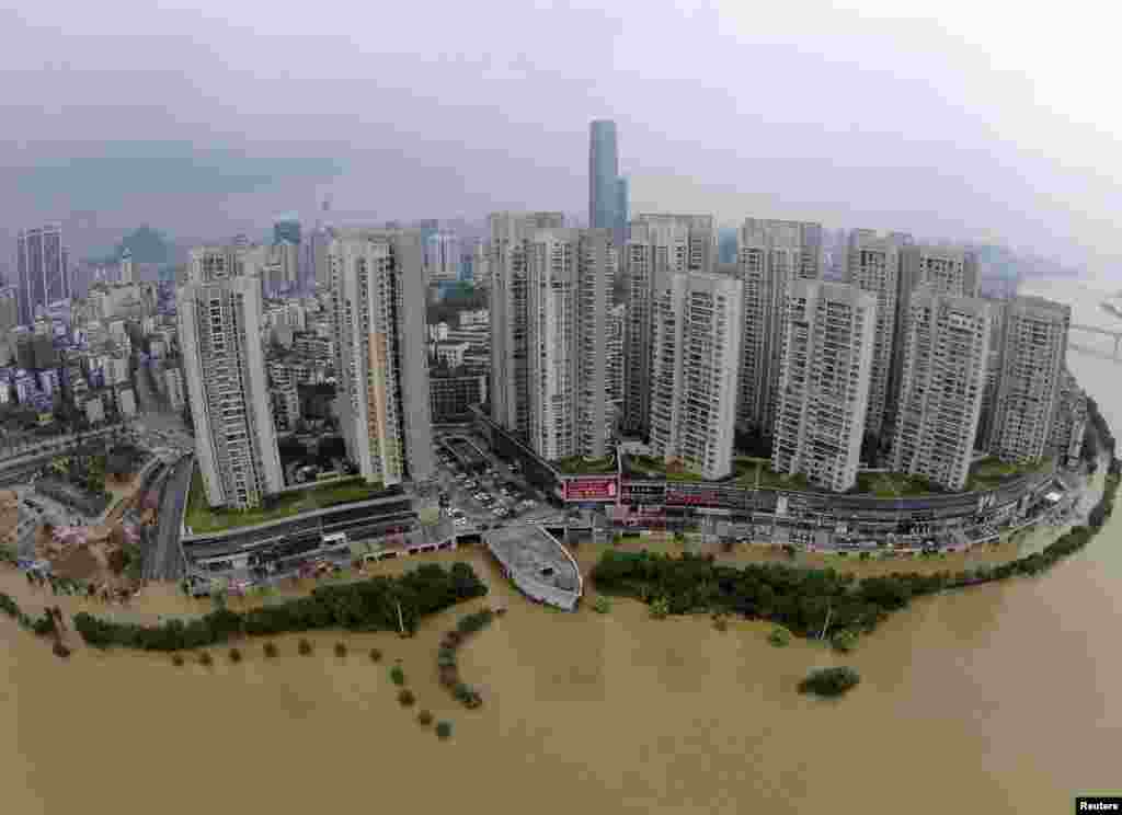 An aerial view shows streets being flooded by an overflowing river after heavy rainfall hit Liuzhou, Guangxi Zhuang Autonomous Region, China.