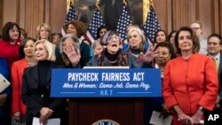 Rep. Rosa DeLauro, D-Conn., sponsor of the Paycheck Fairness Act, center, flanked by Lilly Ledbetter, left, an activist for workplace equality, and Speaker of the House Nancy Pelosi, D-Calif., speaks at the Capitol in Washington, Jan. 30, 2019.