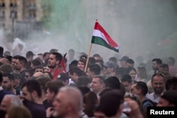 People attend an anti-government protest in Budapest, Hungary, on April 6, 2024.