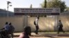 People pass by the Ministry of Petroleum and Mining in Juba, November 7, 2012. 