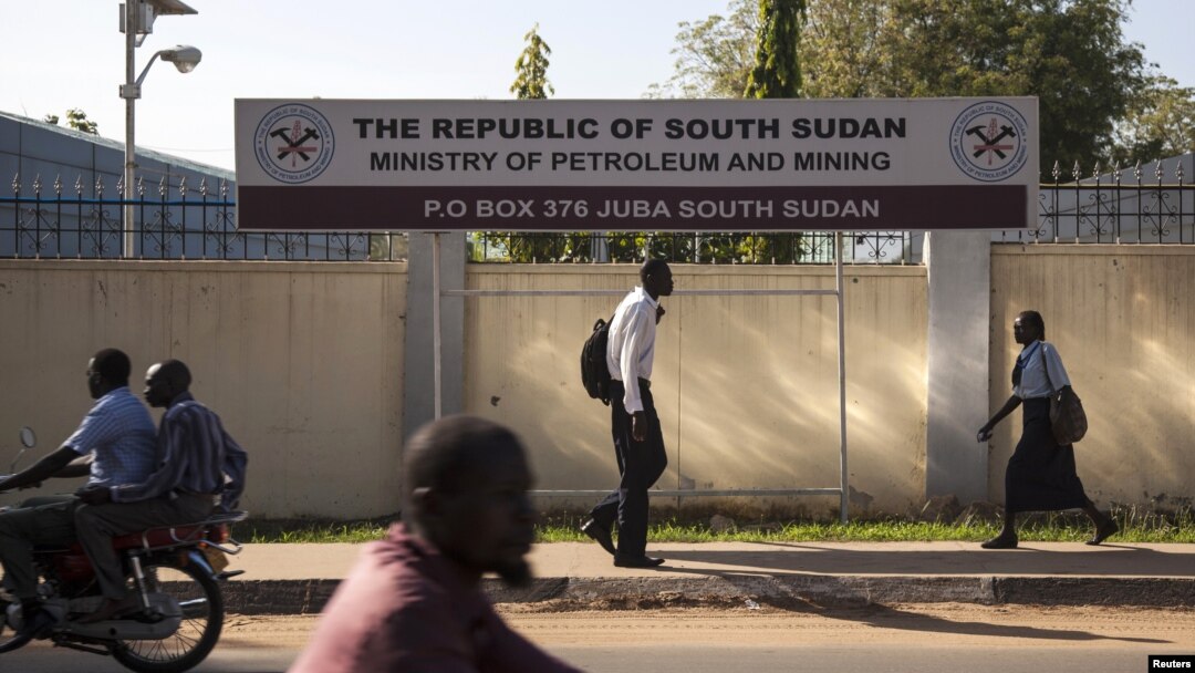 People pass by the Ministry of Petroleum and Mining in Juba, November 7, 2012. 
