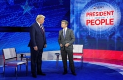 U.S. President Donald Trump takes the stage with ABC News chief anchor George Stephanopoulos for a town hall event in Philadelphia, Pennsylvania, Sept. 15, 2020.