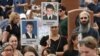 People take part in a commemoration ceremony marking the 20th anniversary of the deadly school siege, at a cemetery in Beslan in the region of North Ossetia–Alania, Russia Sept. 3, 2024. 