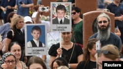 People take part in a commemoration ceremony marking the 20th anniversary of the deadly school siege, at a cemetery in Beslan in the region of North Ossetia–Alania, Russia Sept. 3, 2024. 