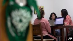 Members of the Marea Verde Chihuahua collective meet at their headquarters in Chihuahua, Mexico on March 13, 2023. (AP Photo/Adriana Esquivel)