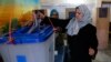 Iraqis Vote Amidst Violence