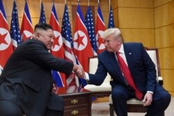FILE - President Donald Trump meets with North Korean leader Kim Jong Un at the border village of Panmunjom in the Demilitarized Zone, South Korea, June 30, 2019.