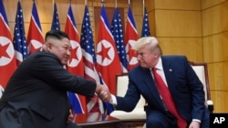 President Donald Trump meets with North Korean leader Kim Jong Un at the border village of Panmunjom in the Demilitarized Zone, South Korea, June 30, 2019. 