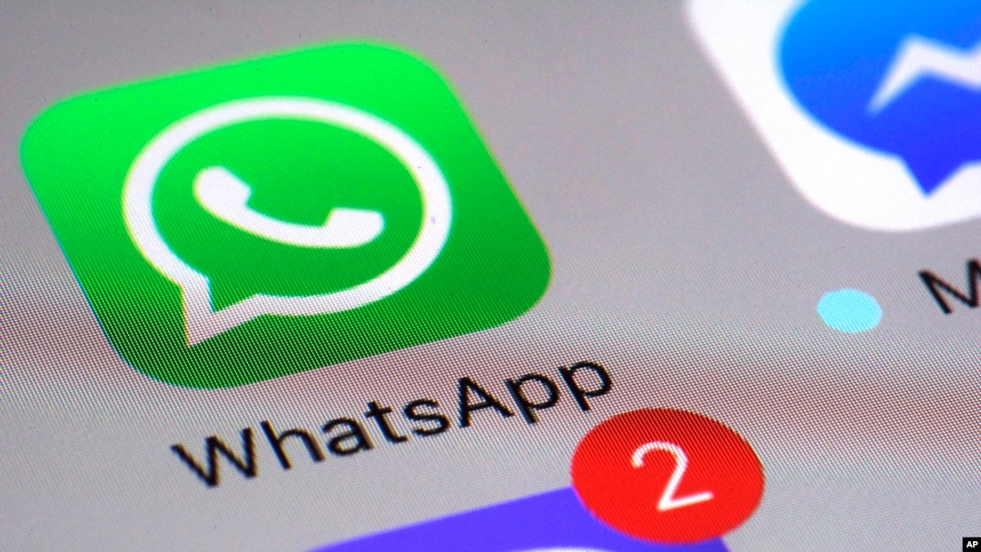 FILE - The WhatsApp messaging platform application appears on a smartphone, March 10, 2017.