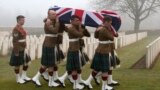 Military pallbearers carry the casket of British World War I soldier William McAleer during a reburial service at the Loos British World War I cemetery in Loos-en-Gohelle, France. Private William McAleer of the 7th Battalion, Royal Scots Fusiliers was killed in action on Sept. 26, 1915 during the Battle of Loos. His body was found and identified in 2010 during routine construction in the area and is being reburied with full military honors along with 19 unknown soldiers.