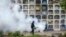 FILE - A specialist fumigates the Nueva Esperanza graveyard in the outskirts of Lima, Jan. 15, 2016. The Zika virus has quickly spread across South America and the Caribbean in recent weeks. 