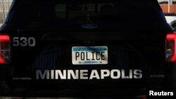 A police vehicle is seen as the Minneapolis Police Department’s fifth precinct remains fenced and barricaded as voters decide whether to abolish the police department and replace it with a new department of public safety in Minneapolis, Minnesota, Nov. 2,