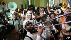 FILE - Musicians play during a ceremony that marks the official start of Carnival in Rio de Janeiro, Brazil, February 9, 2024.