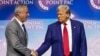 (FILES) Former US President and Republican presidential candidate Donald Trump (2nd L) shakes hands with US politician Robert F. Kennedy Jr. as he invites him former US Representative Tulsi Gabbard (R) and US commentator Tucker Carlson onto the stage duri