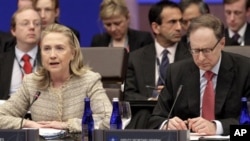 Secretary of State Hillary Rodham Clinton, accompanied by NATO Deputy Secretary General Alexander Vershbow, speaks at a meeting of the NATO Foreign Ministers during the NATO Summit, Monday, May 21, 2012, in Chicago. (AP Photo/M. Spencer Green)