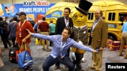 Berkshire Hathaway shareholders pose with Mr. Peanut at the shareholder shopping day as part of the Berkshire Hathaway annual meeting weekend in Omaha, Nebraska, May 5, 2017.