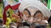 Max Saatchi wears a mask depicting Iranian President Hassan Rouhani during a &quot;No to Rouhani, Yes to Human Rights in Iran Rally&quot; organized by the National Council of Resistance to Iran, outside the United Nations headquarters in New York, during the U.N. General Assembly meetings.