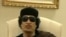Muammar Gaddafi gestures as he speaks at a Tripoli hotel in this still image from a video by Libyan TV released May 11, 2011.