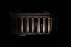 The ancient Parthenon is pictured just before the lights on the Acropolis hill shut down for Earth Hour in Athens, Greece, March 27, 2021.