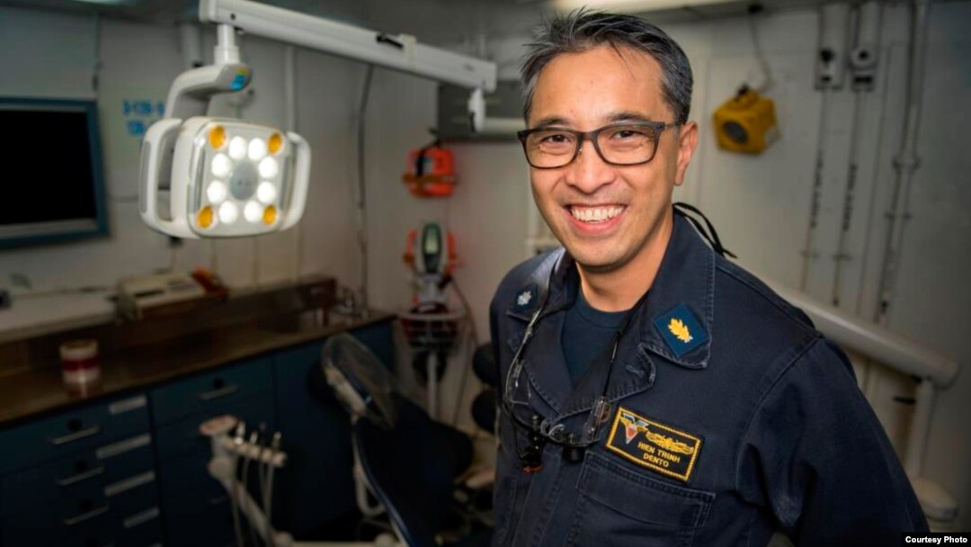 FILE - Vietnamese American Hien Trinh on the USS Carl Vinson.