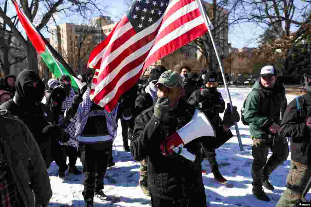 A counter-protester supporting America First views shouts slogans as people take part in a protest held on the day of the inauguration of U.S. President Donald Trump, in Washington, Jan. 20, 2025.