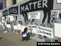 FILE - Murals appear throughout New York City in response to the death of George Floyd while in police custody in Minneapolis, June 10, 2020.