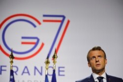 French President Emmanuel Macron attends a joint press conference with U.S. President Donald Trump (not seen) at the end of the G-7 summit in Biarritz, France, Aug. 26, 2019.