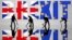 Small toy figures are seen in front of a Brexit logo in this illustration picture, March 30, 2019. 