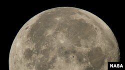 FILE - The moon is seen Aug. 2, 2015. NASA launched an effort on Thursday to pay companies to mine rocks, dirt and other lunar materials. 