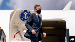 Secretary of State Antony Blinken boards his plane at Jomo Kenyatta International Airport in Nairobi, Kenya, Thursday, Nov. 18, 2021, to travel to Abuja, Nigeria. Blinken is on a five day trip to Kenya, Nigeria, and Senegal.