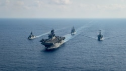 Royal Australian Navy guided-missile frigate HMAS Parramatta (L) sails with U.S. Navy Amphibious assault ship USS America, USS Bunker Hill and USS Barry in the South China Sea, April 18, 2020. (Credit: U.S. Navy)